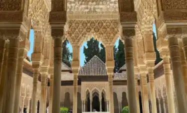 Patio of the Lions in Alhambra Granada with marble columns, central fountain and Islamic architecture