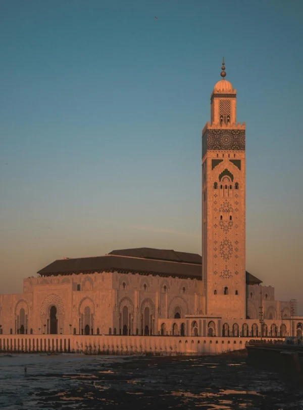 The Hassan II Mosque in Casablanca, showcasing its minaret and Atlantic location.